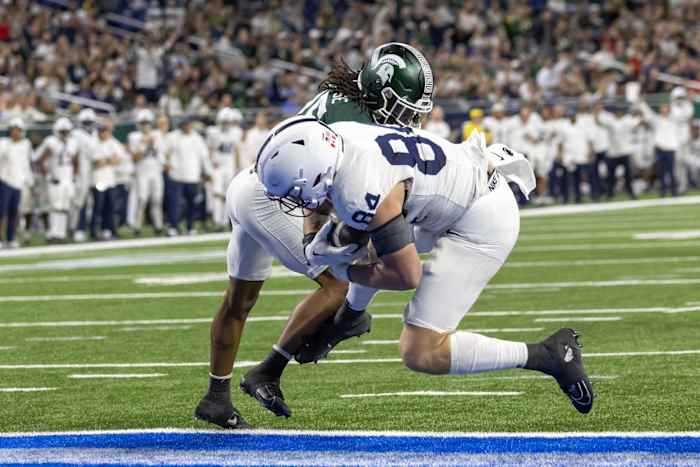 Nov 24, 2023; Detroit, Michigan, USA; Penn State Nittany Lions tight end Theo Johnson (84) scores a touchdown against the Michigan State Spartans during the second half at Ford Field. Mandatory Credit: David Reginek-USA TODAY Sports